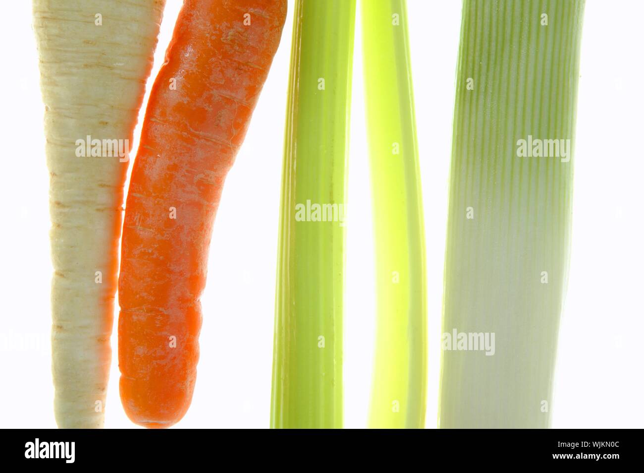 Celery, leek, carrot, transparent over white studio background Stock