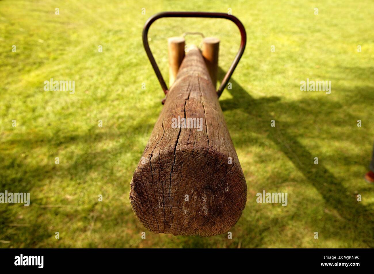old wooden balance teeter totter in the park, grass background Stock ...