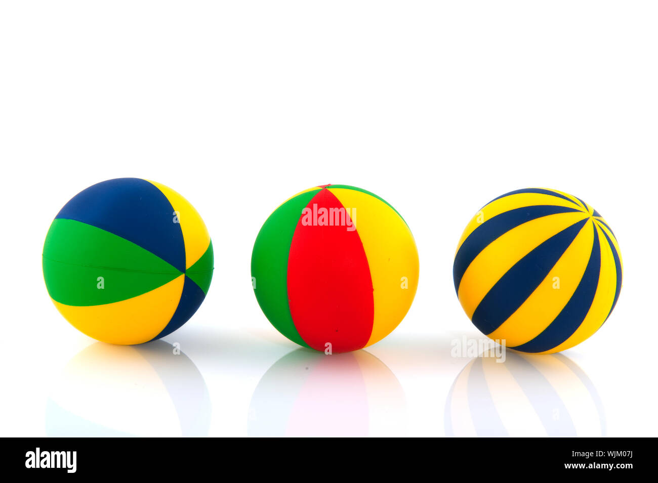 Three colorful toy balls isolated over white Stock Photo Alamy