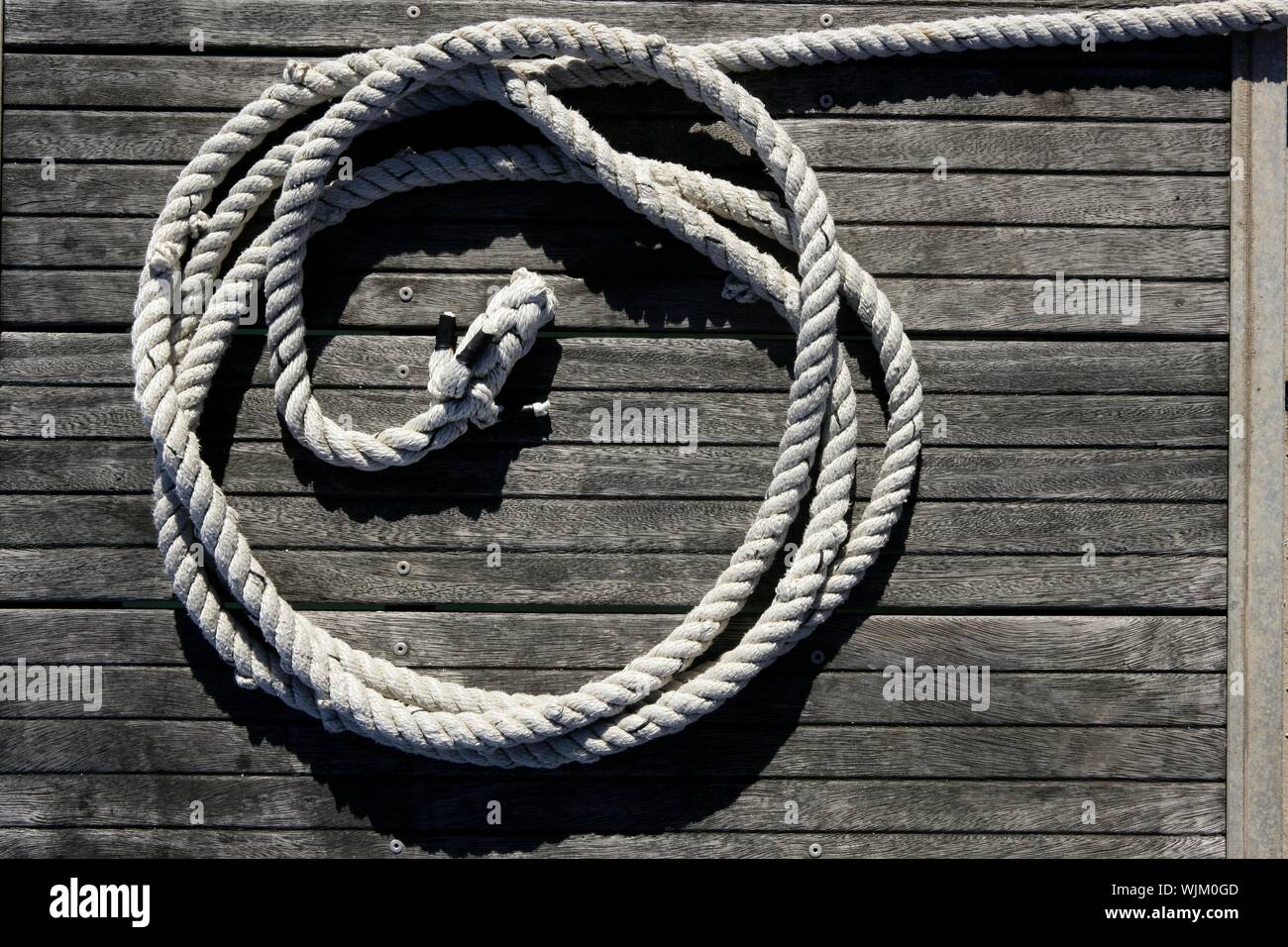 Nautical marine round thread over dried gray teak wood background Stock ...