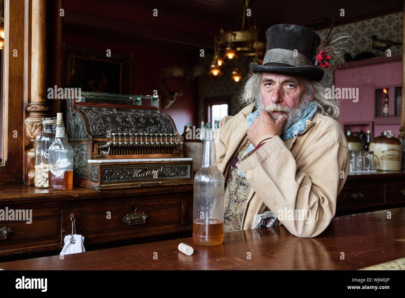 Historic reenactor Dave Johnston (as the town bartender and possibly its drunk) at South Park City Museum, a collection of historic buildings in Fairplay, Colorado Stock Photo