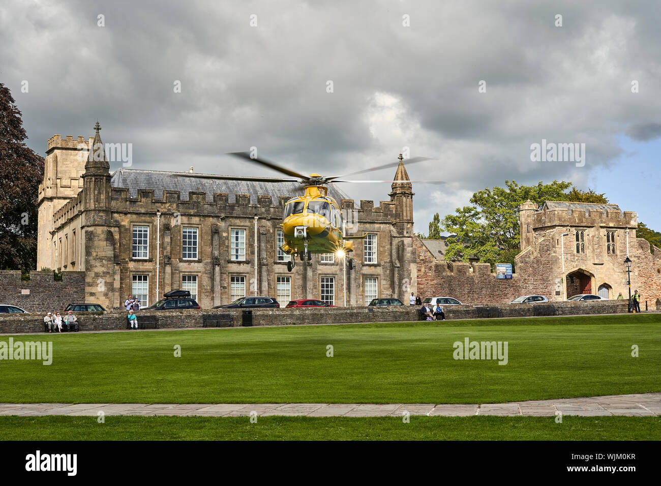 Dorset and Somerset Air Ambulance Helicopter taking off from Wells Cathedral Green. The Dorset and Somerset Air Ambulance is a registered charity Stock Photo