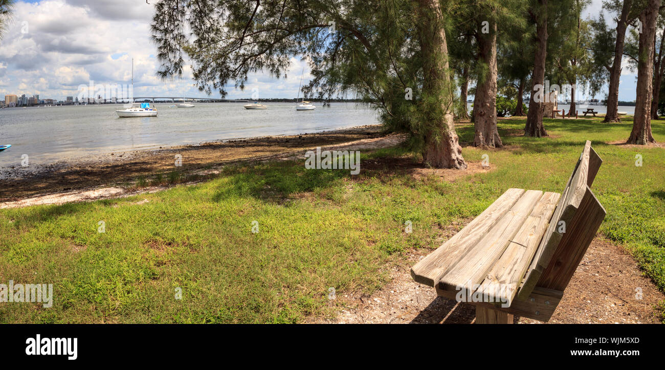 Bench view of Boats at the Ken Thompson park in Sarasota, Florida Stock Photo