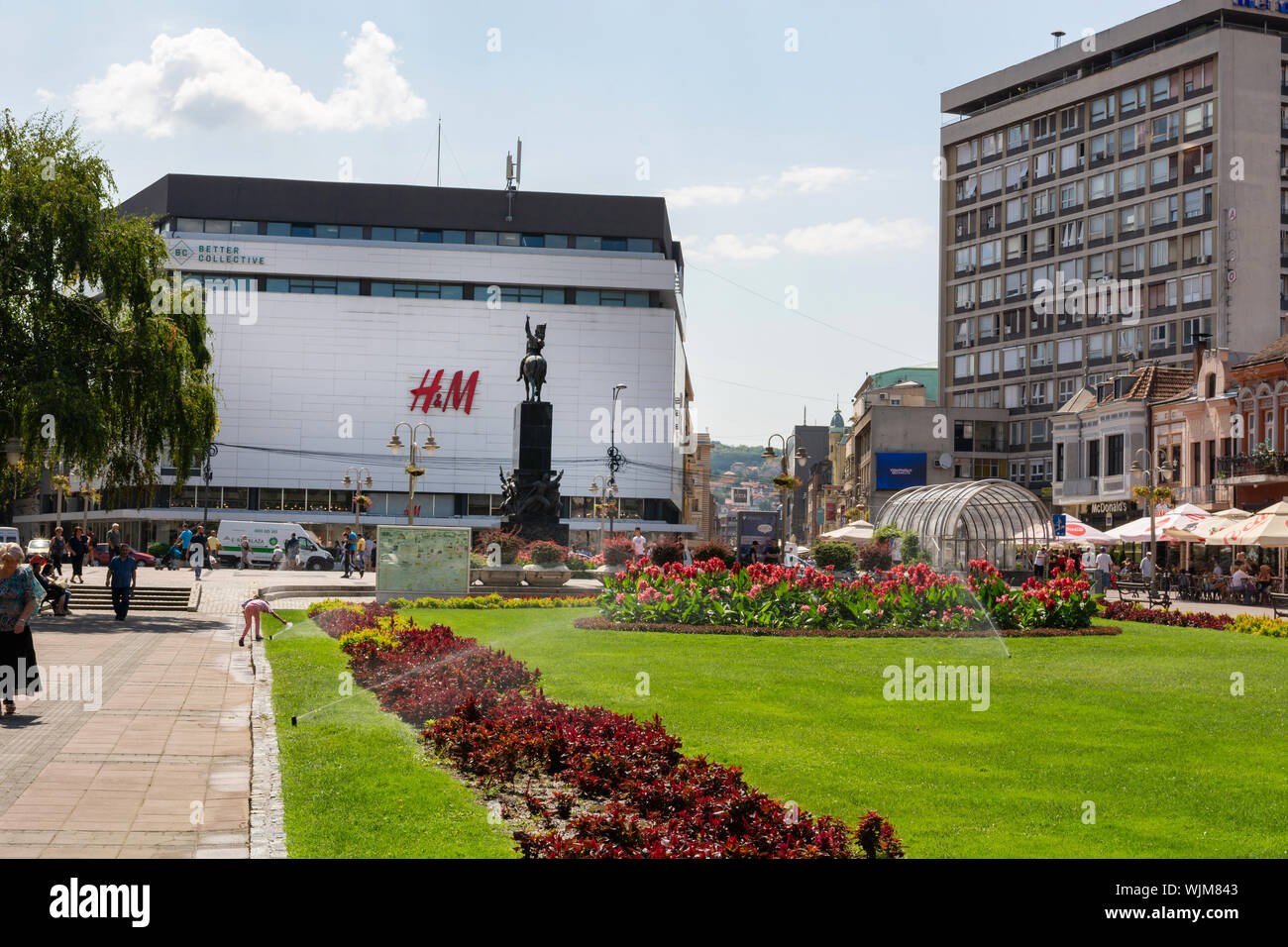Nis, Serbia - August 28, 2019: Big public park with green lawn and flowers  in city downtown with a promenade on summer sunny day in the city of Nis  Stock Photo - Alamy