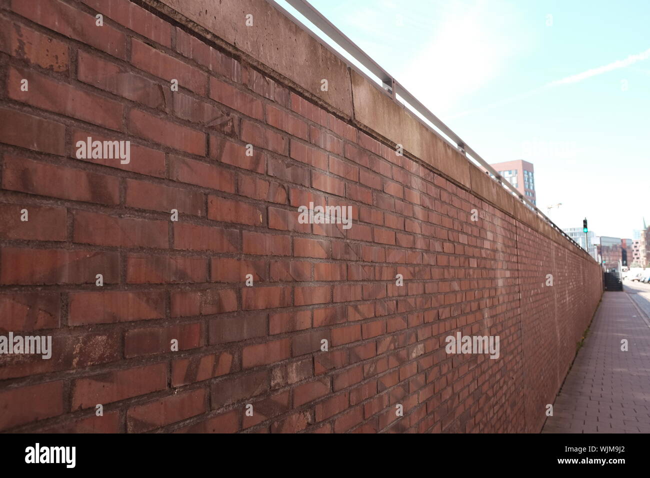 Red Brick Wall In City Stock Photo