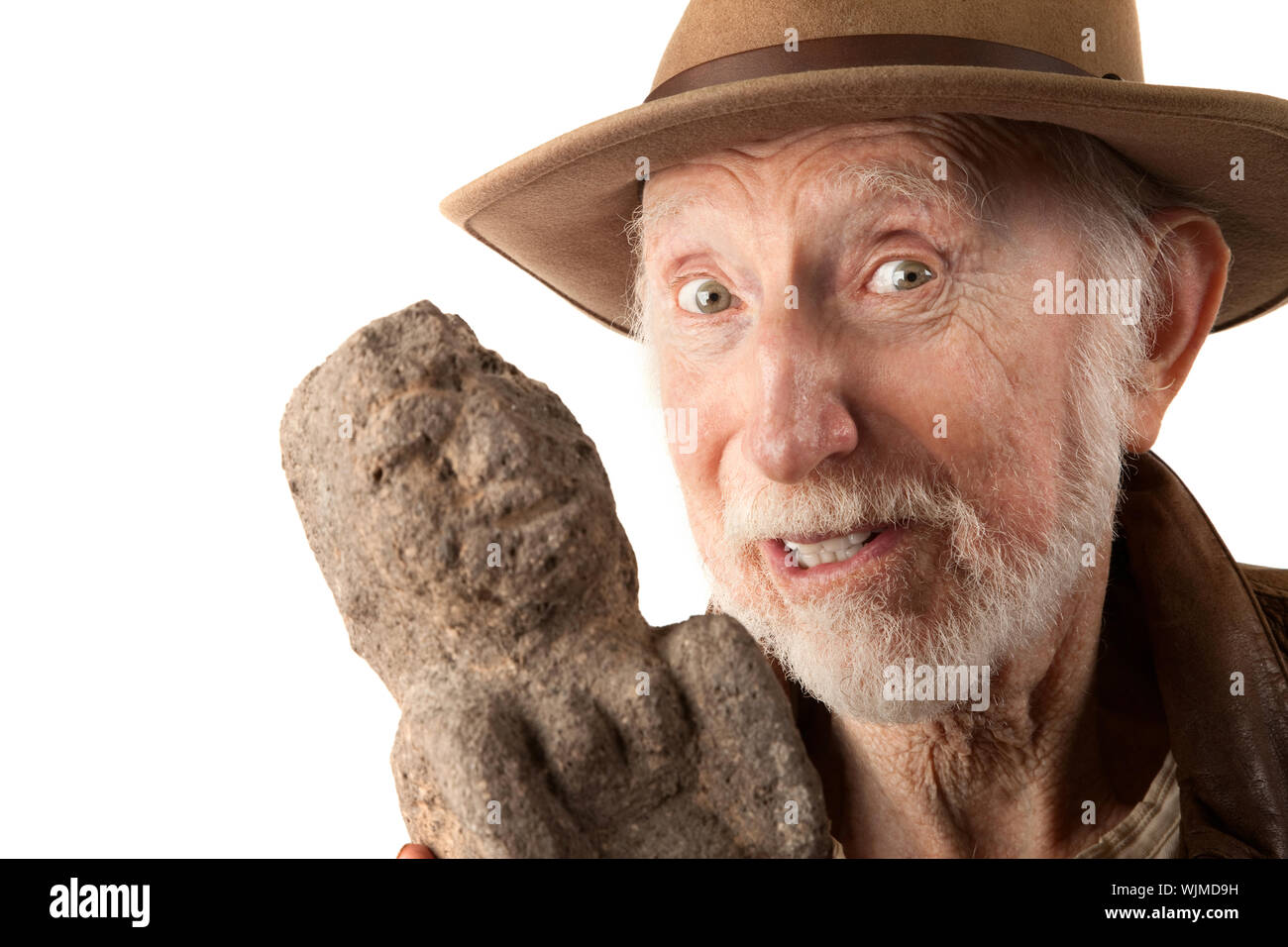 Adventurer or archaeologist in brown leather jacket with idol Stock Photo -  Alamy