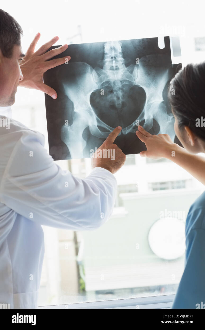 Doctor and nurse analyzing xray in hospital Stock Photo - Alamy