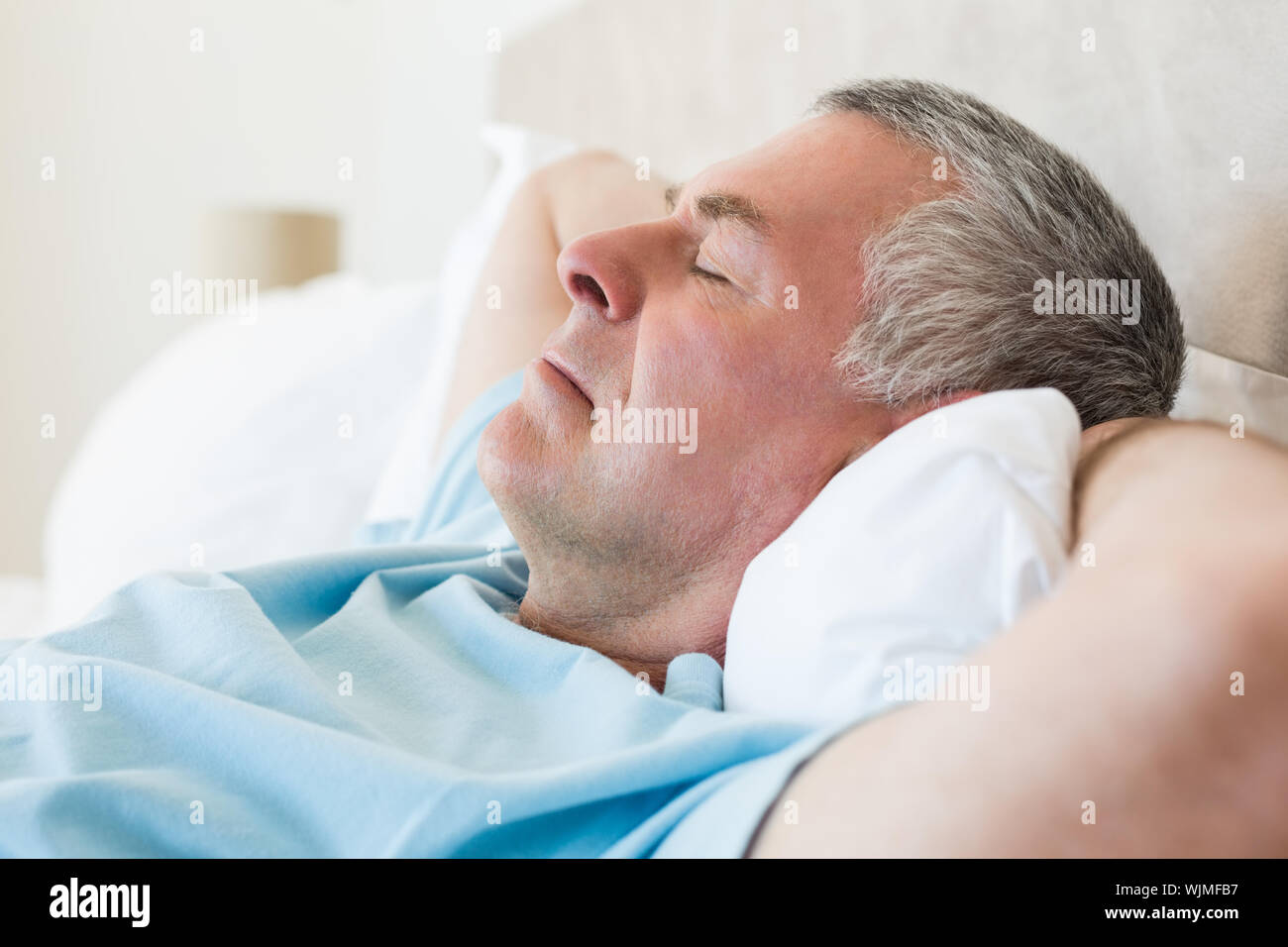 Closeup of senior man sleeping in bed at home Stock Photo - Alamy