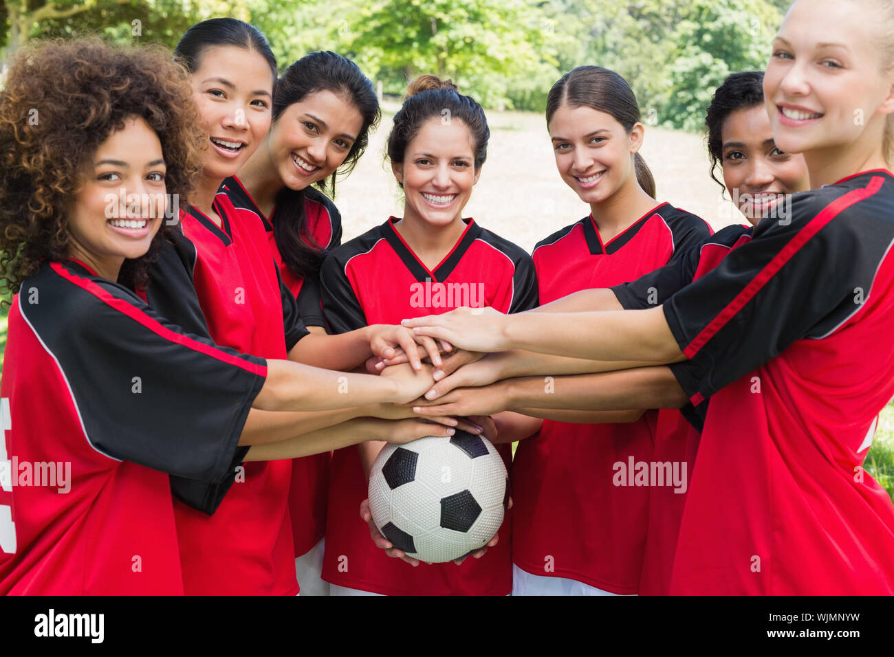Female soccer team stacking hands hi-res stock photography and images ...