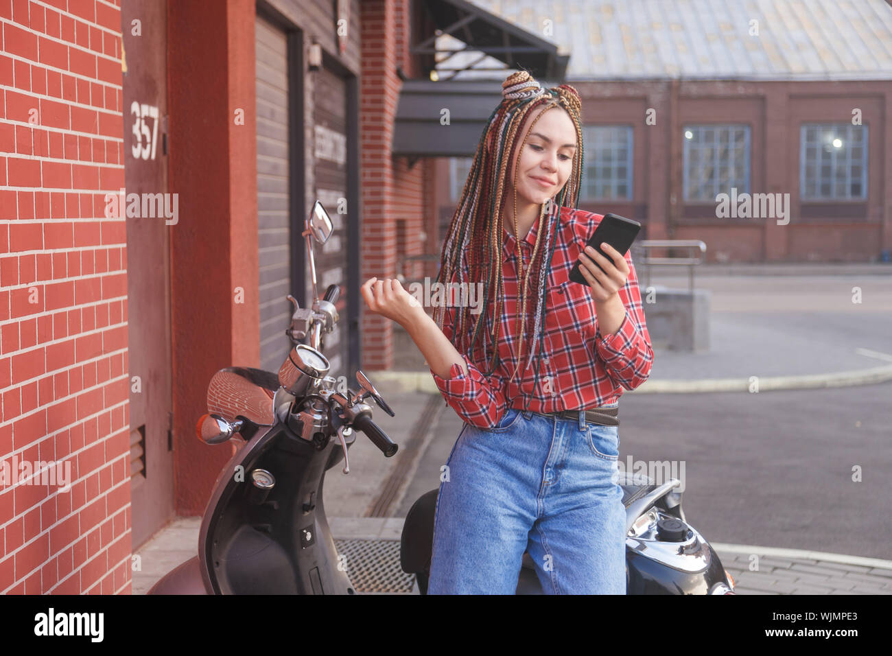 Girl on moped hires stock photography and images Alamy