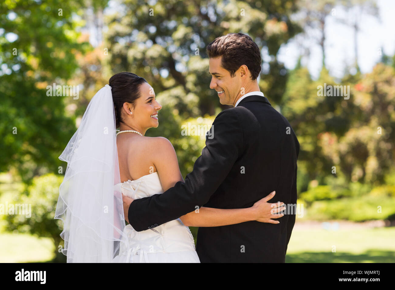 Woman arms around man wedding hi-res stock photography and images - Alamy