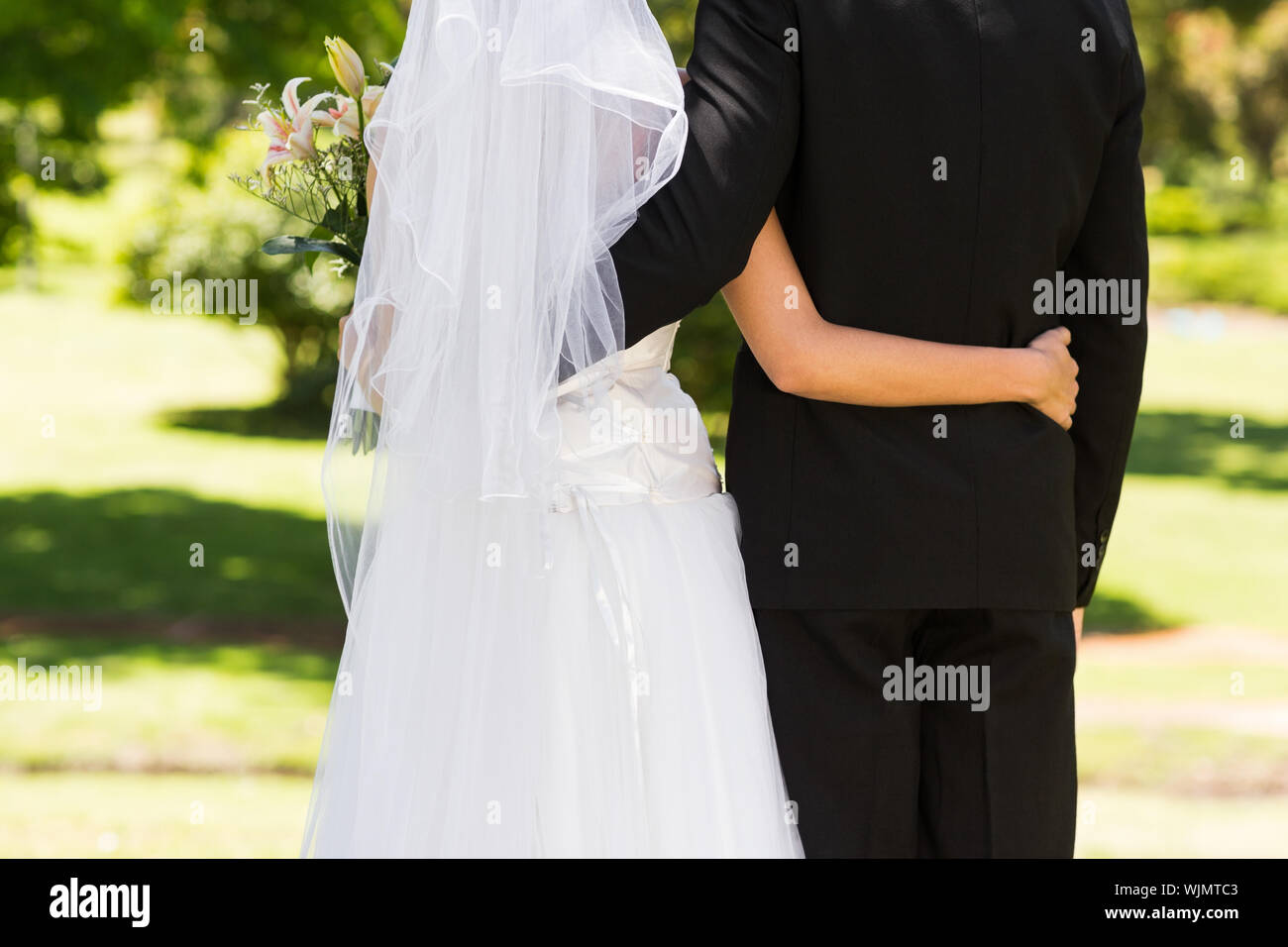 Woman arms around man wedding hi-res stock photography and images - Alamy