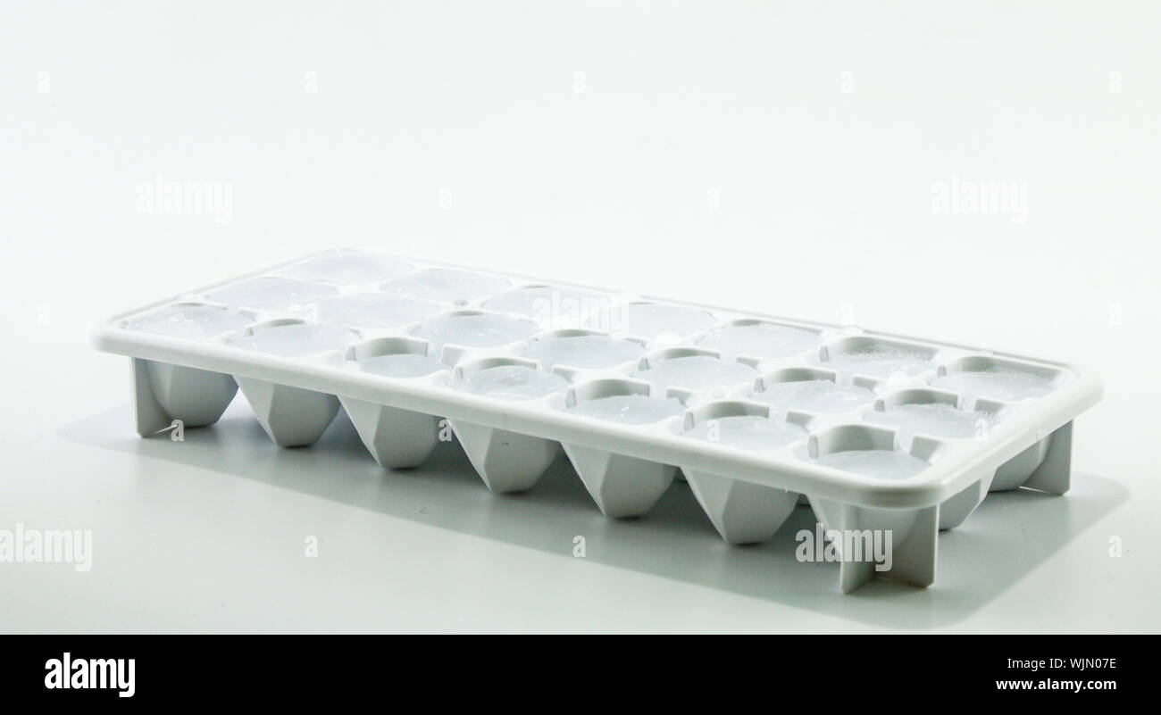 Ice cube removed from the refrigerator. Black Background Stock Photo