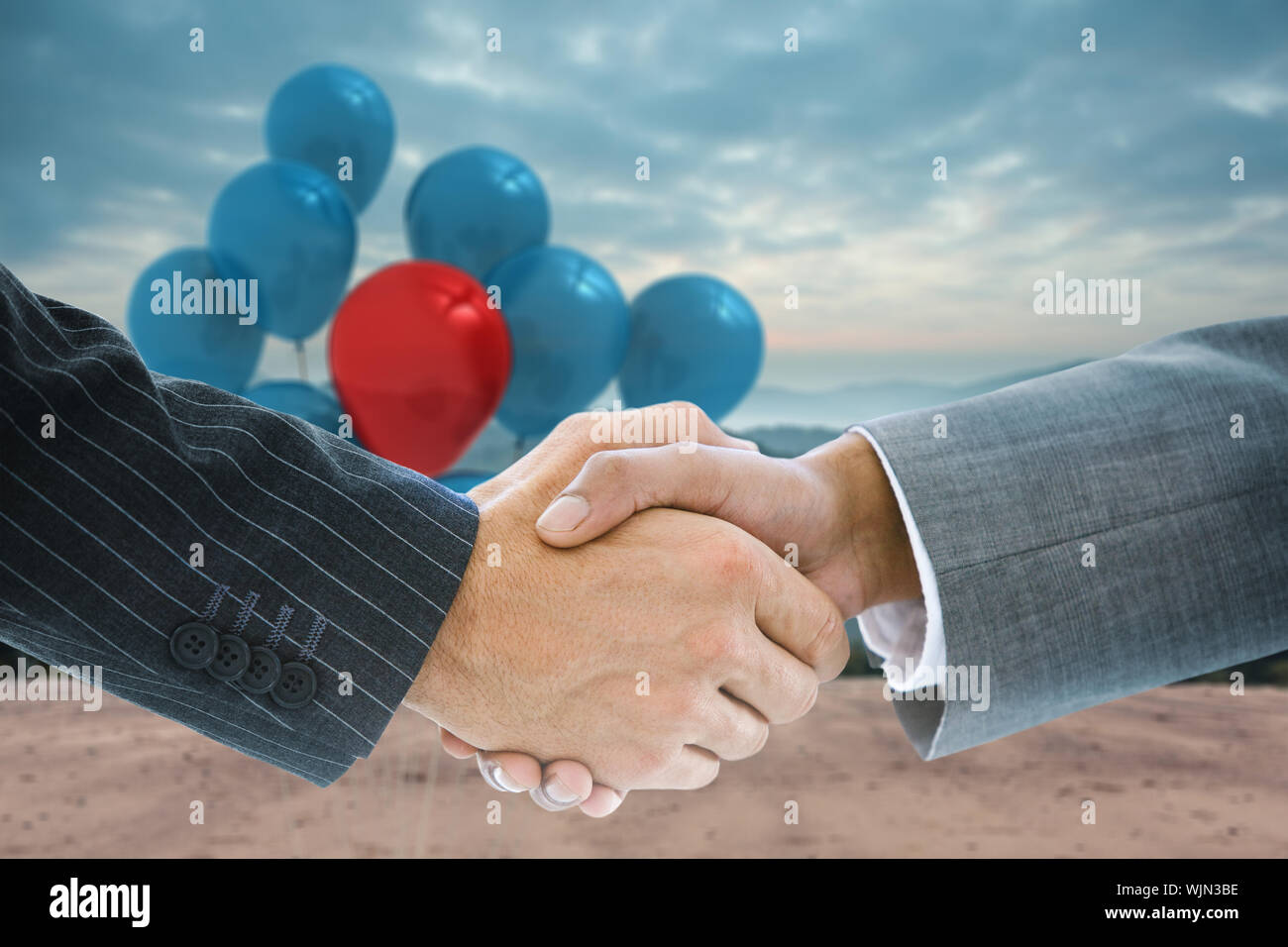 Composite image of business handshake against technological background with hexagons Stock Photo