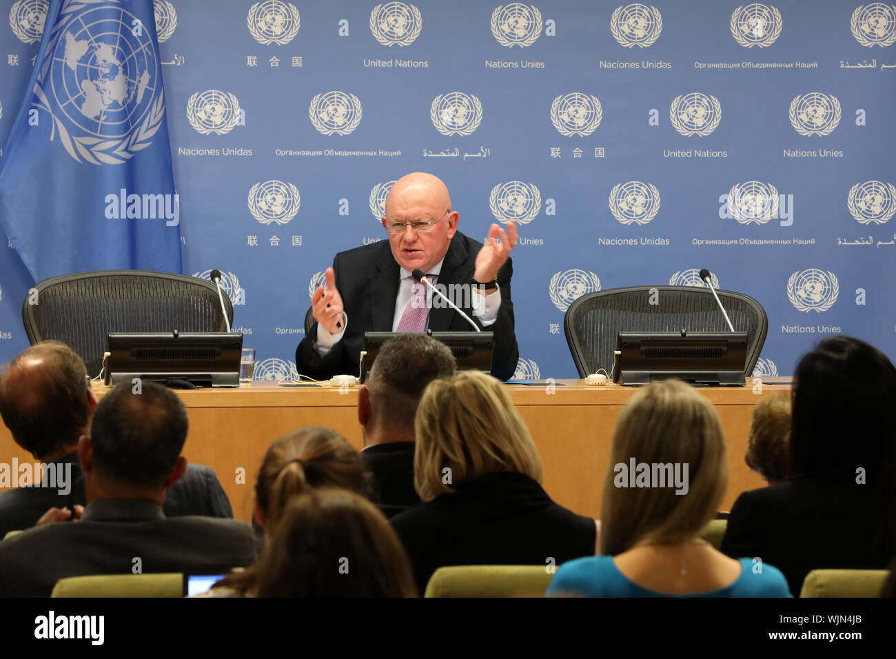 United Nations, UN headquarters in New York. 3rd Sep, 2019. Vassily Nebenzia (Rear), Russia's UN ambassador and president of the Security Council for the month of September, speaks to journalists during a press briefing at the UN headquarters in New York, on Sept. 3, 2019. United Nations Security Council will highlight UN cooperation with regional organizations and the settlement of African problems in September, Vassily Nebenzia said Tuesday. Credit: Ma Jianguo/Xinhua/Alamy Live News Stock Photo