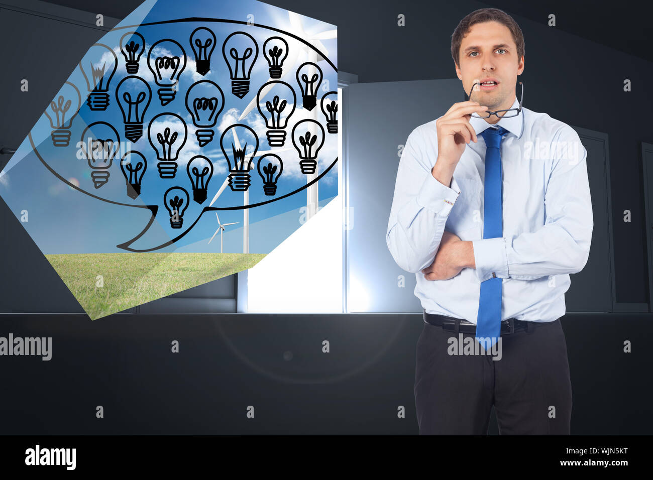 Thinking businessman biting glasses against door opening revealing light Stock Photo