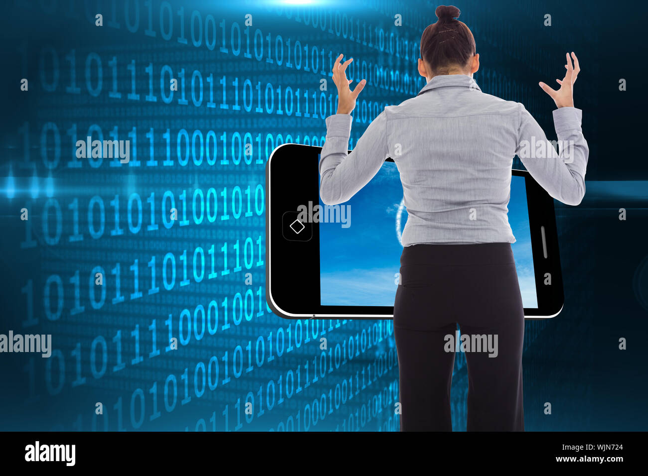 Businesswoman gesturing against shiny blue binary code on black background Stock Photo