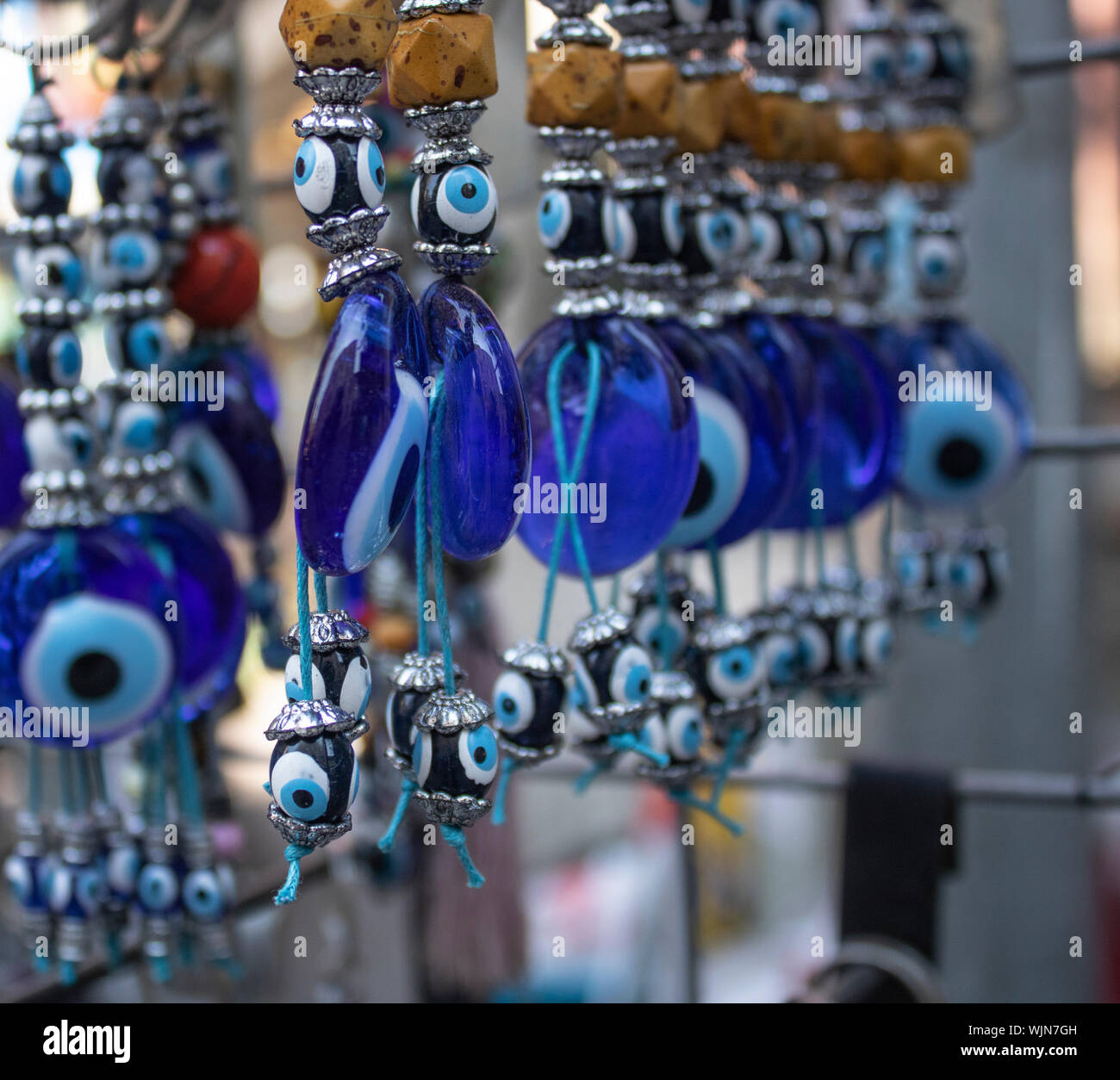 Traditional evil eye bead. Souvenir. Blurred background. To bring good