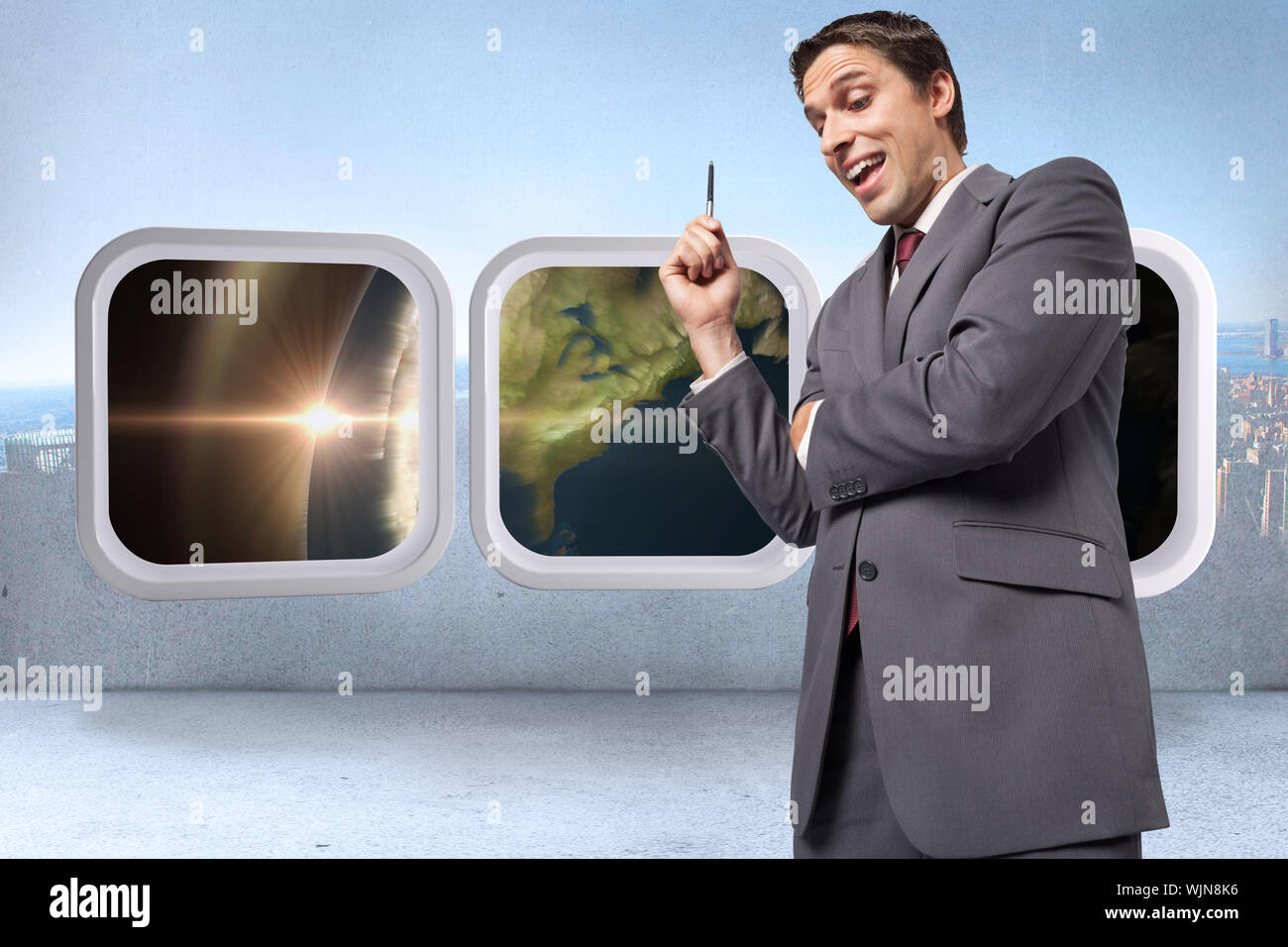 Thoughtful businessman holding pen against city scene in a room Stock ...