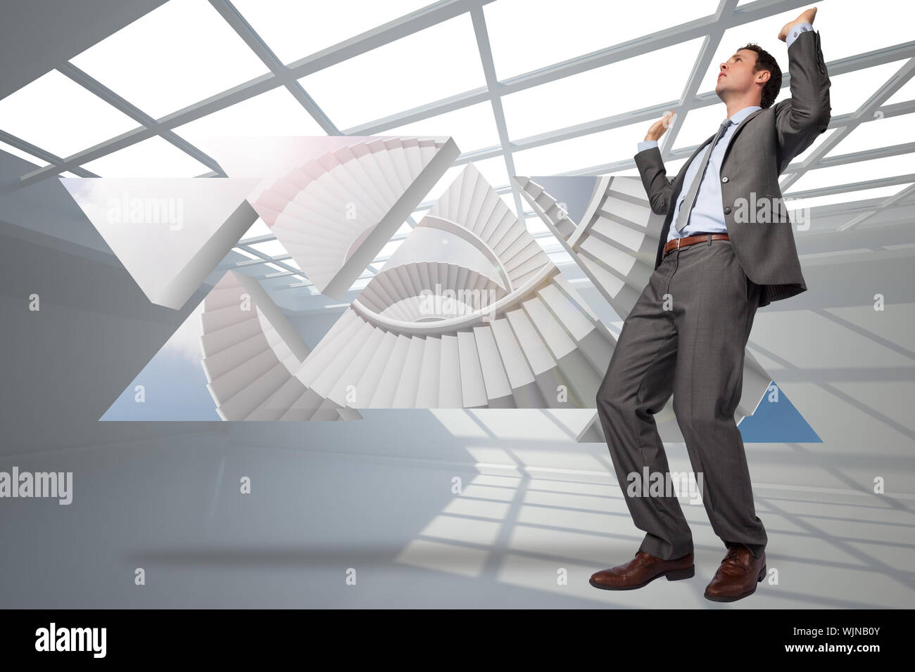 Businessman Posing With Hands Up Against White Room With