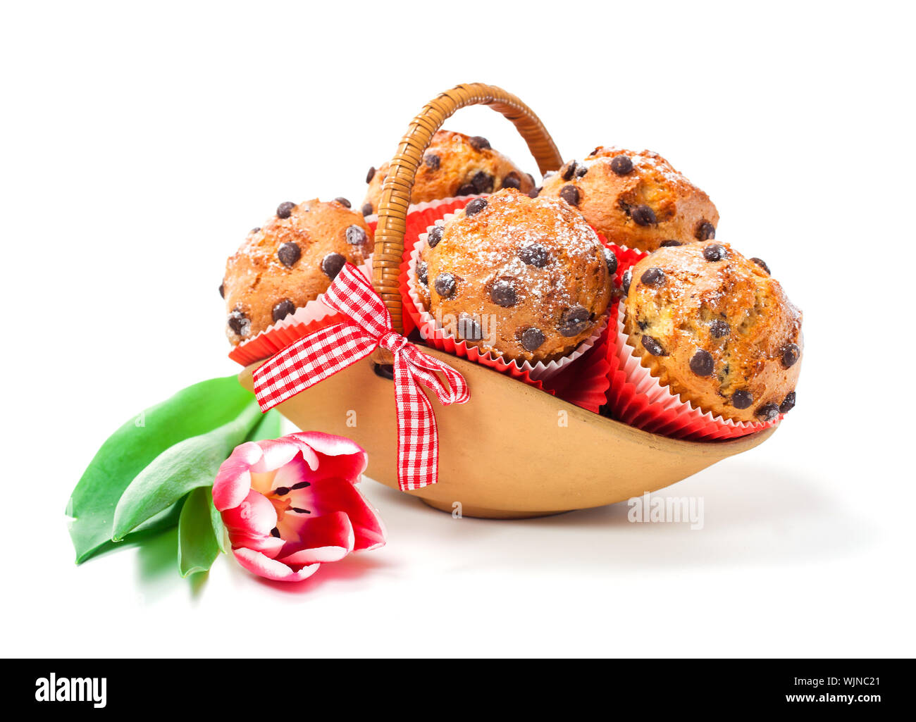 Muffins in a basket isolated on white background Stock Photo - Alamy