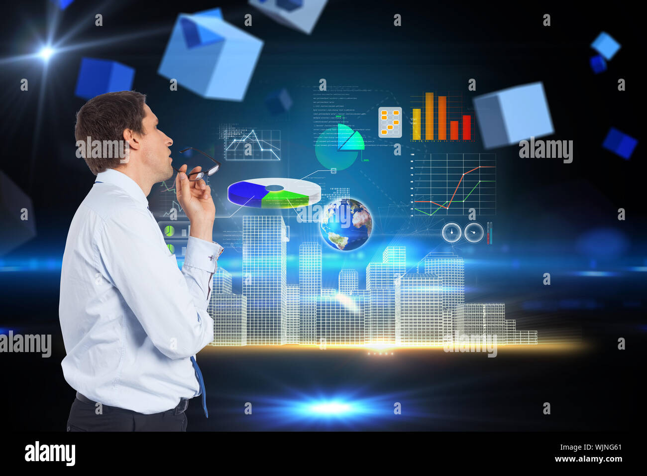 Thinking businessman biting glasses against boxes on technical background Stock Photo