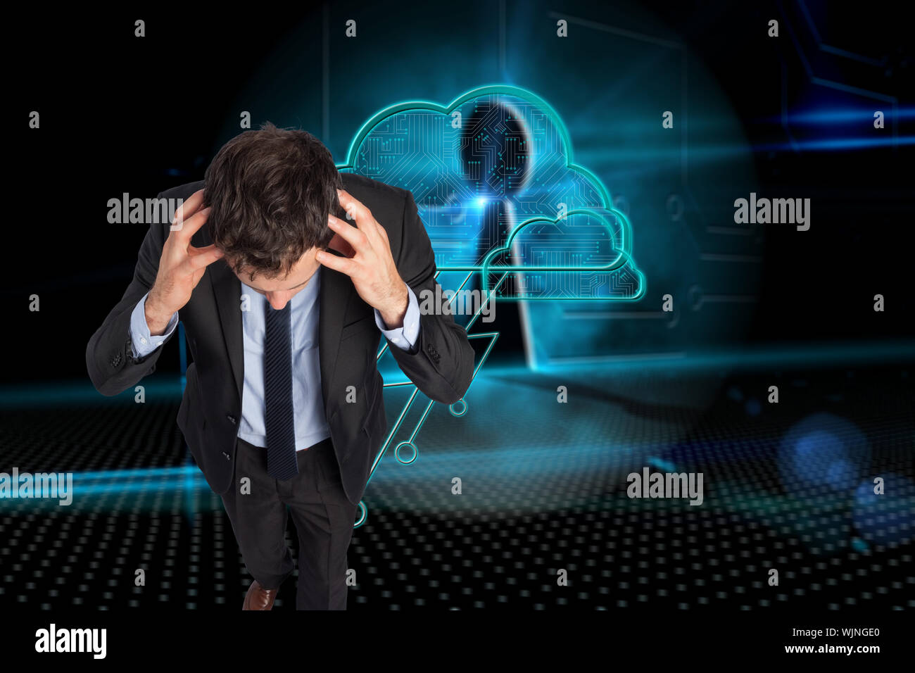 Stressed businessman with hands on head against keyhole on technological background Stock Photo
