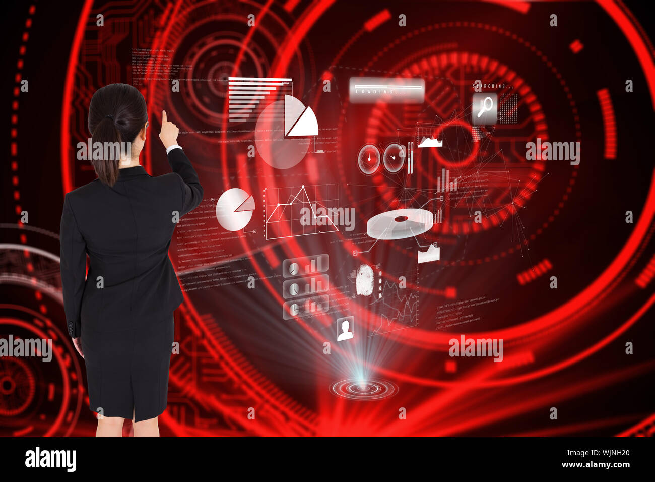 Businesswoman pointing against shiny red circles on black background Stock Photo