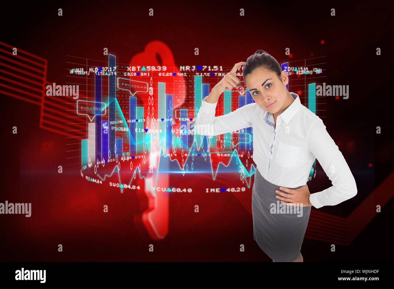 Focused businesswoman against shiny red key on black background Stock Photo