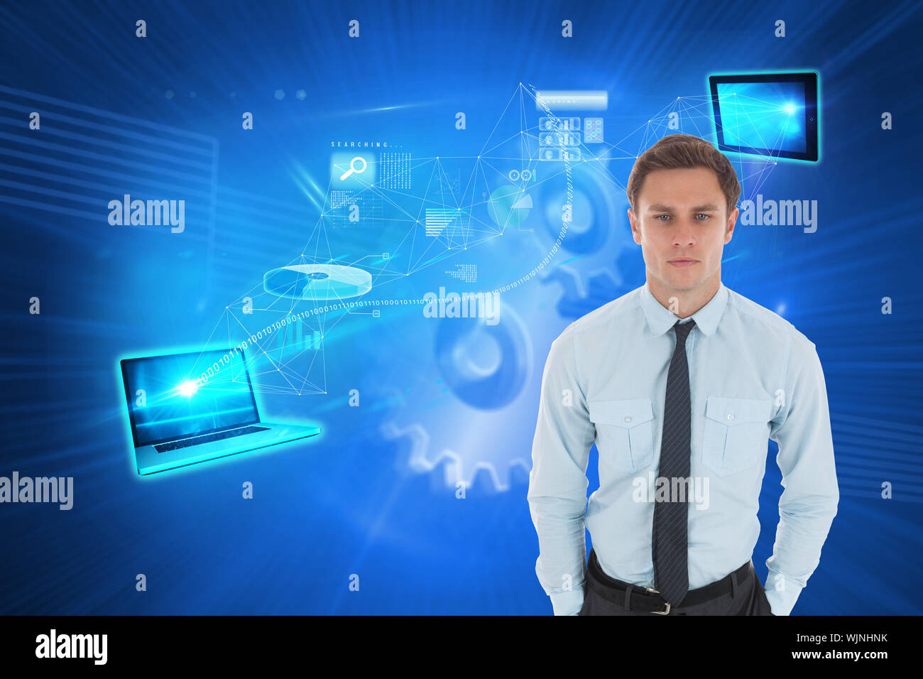 Serious businessman with hands in pockets against shiny cogs on blue background Stock Photo