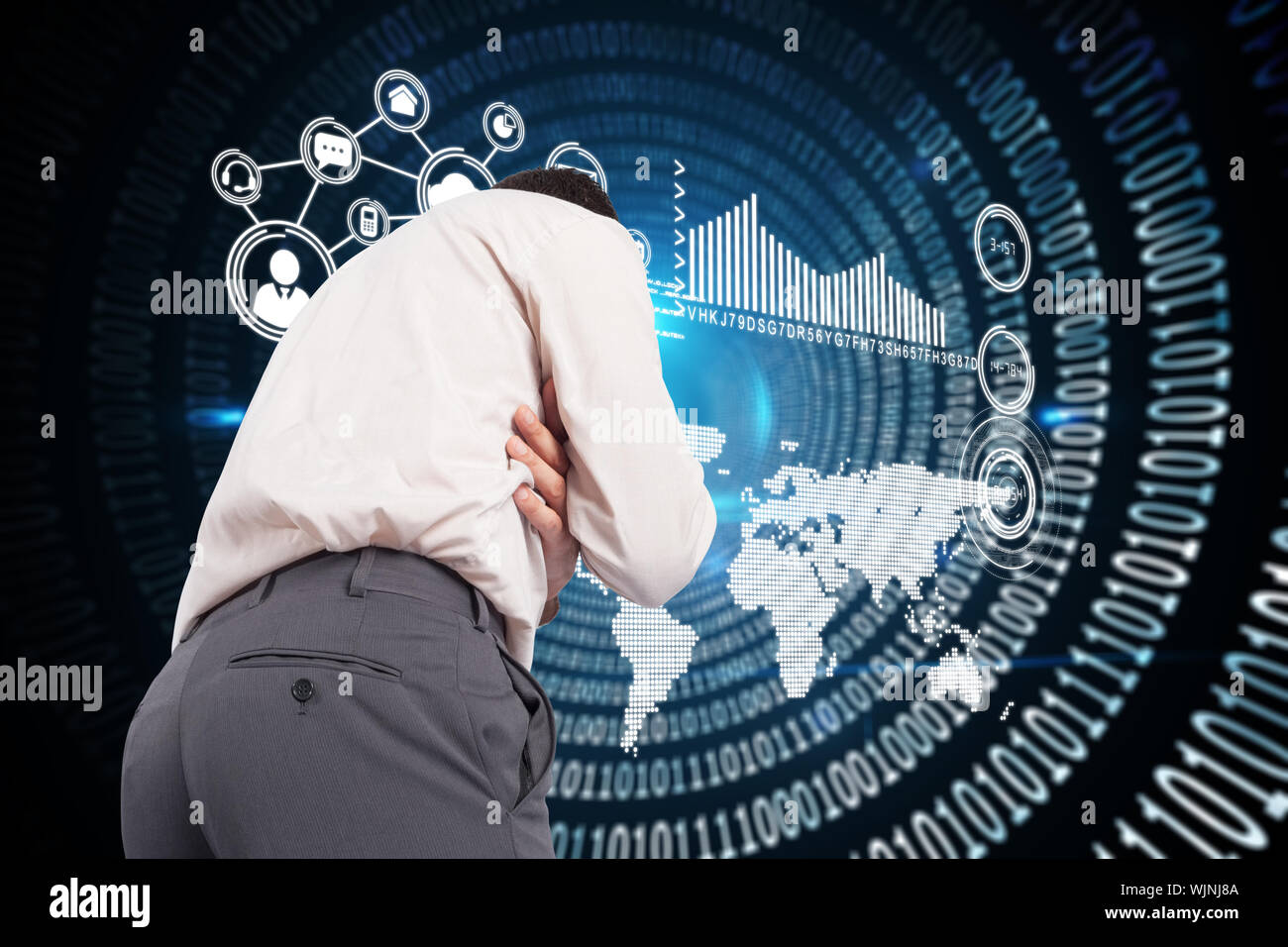 Thoughtful businessman with hand on chin against spiral of shiny binary code Stock Photo