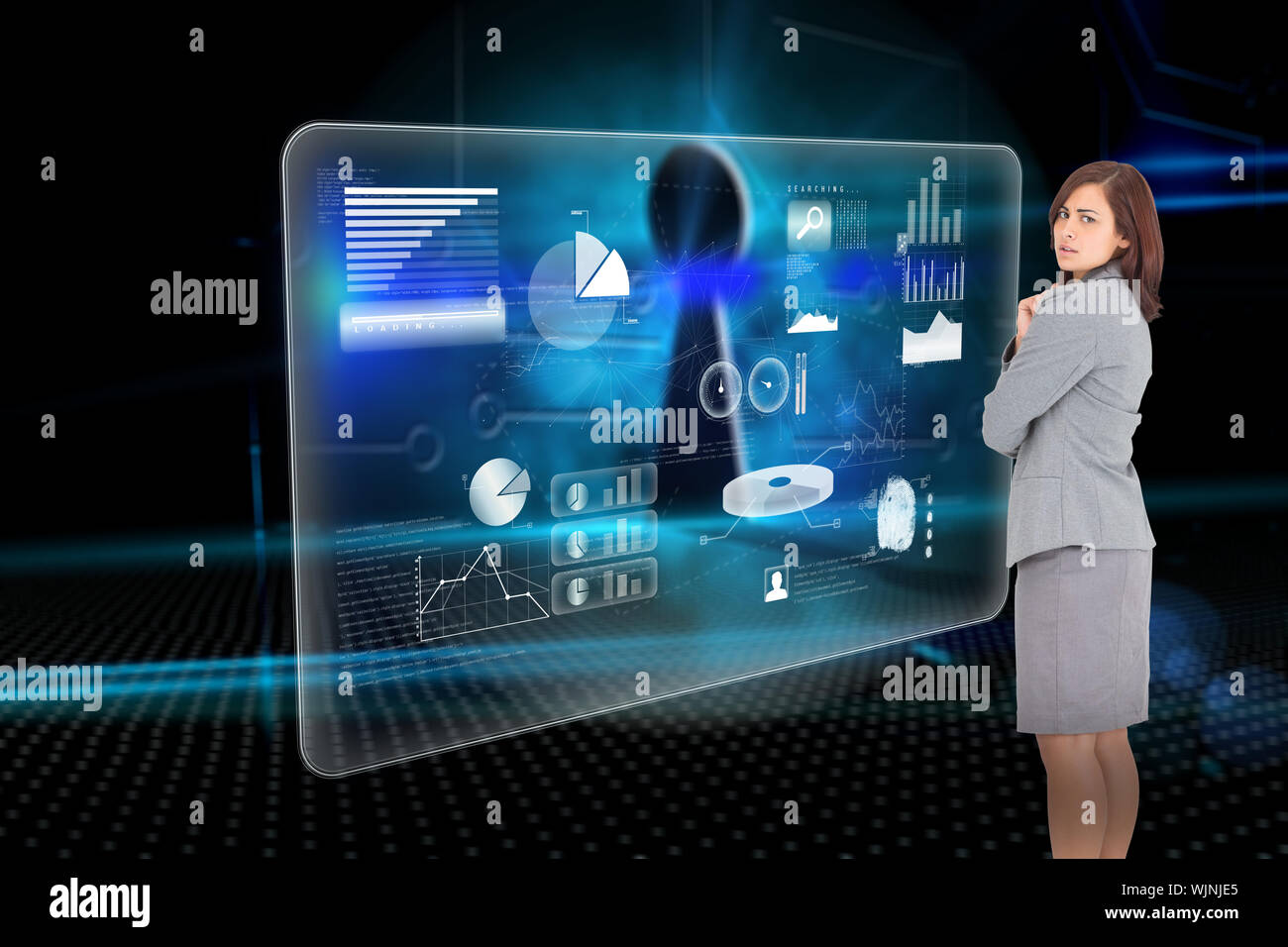 Focused businesswoman against keyhole on technological background Stock Photo
