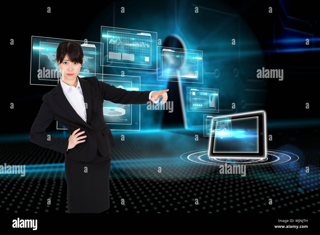 Businesswoman pointing against keyhole on technological background Stock Photo