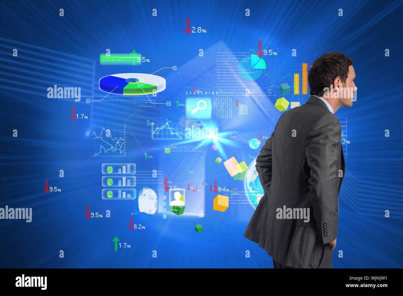 Serious businessman with hands on hips against shiny house on blue background Stock Photo