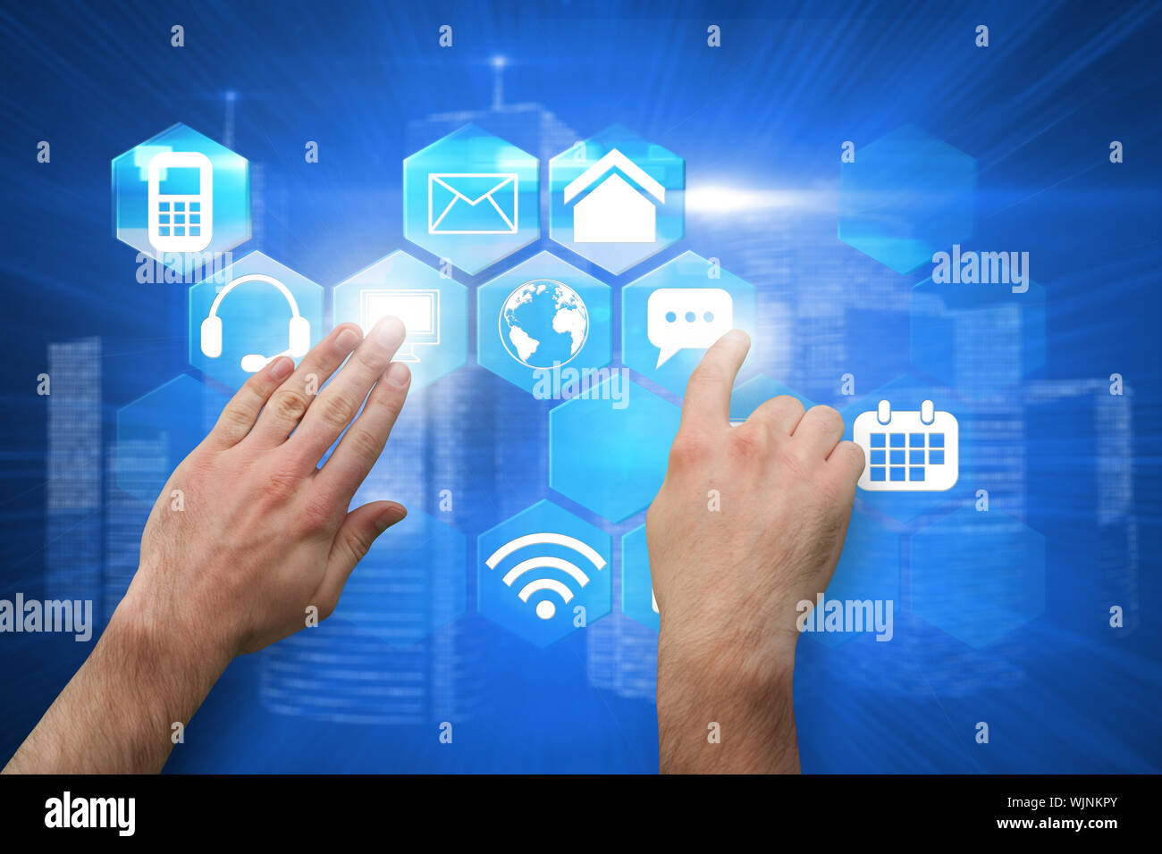 Hands pointing and presenting against futuristic shiny cityscape Stock Photo