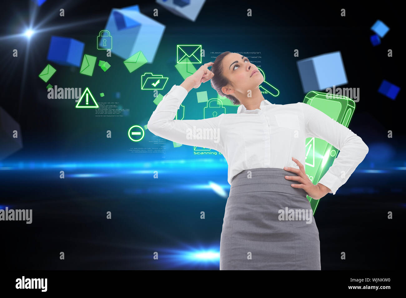 Focused businesswoman against boxes on technical background Stock Photo