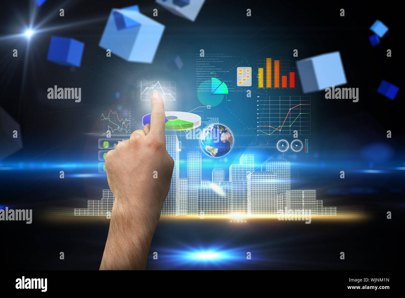 Hand pointing against boxes on technical background Stock Photo