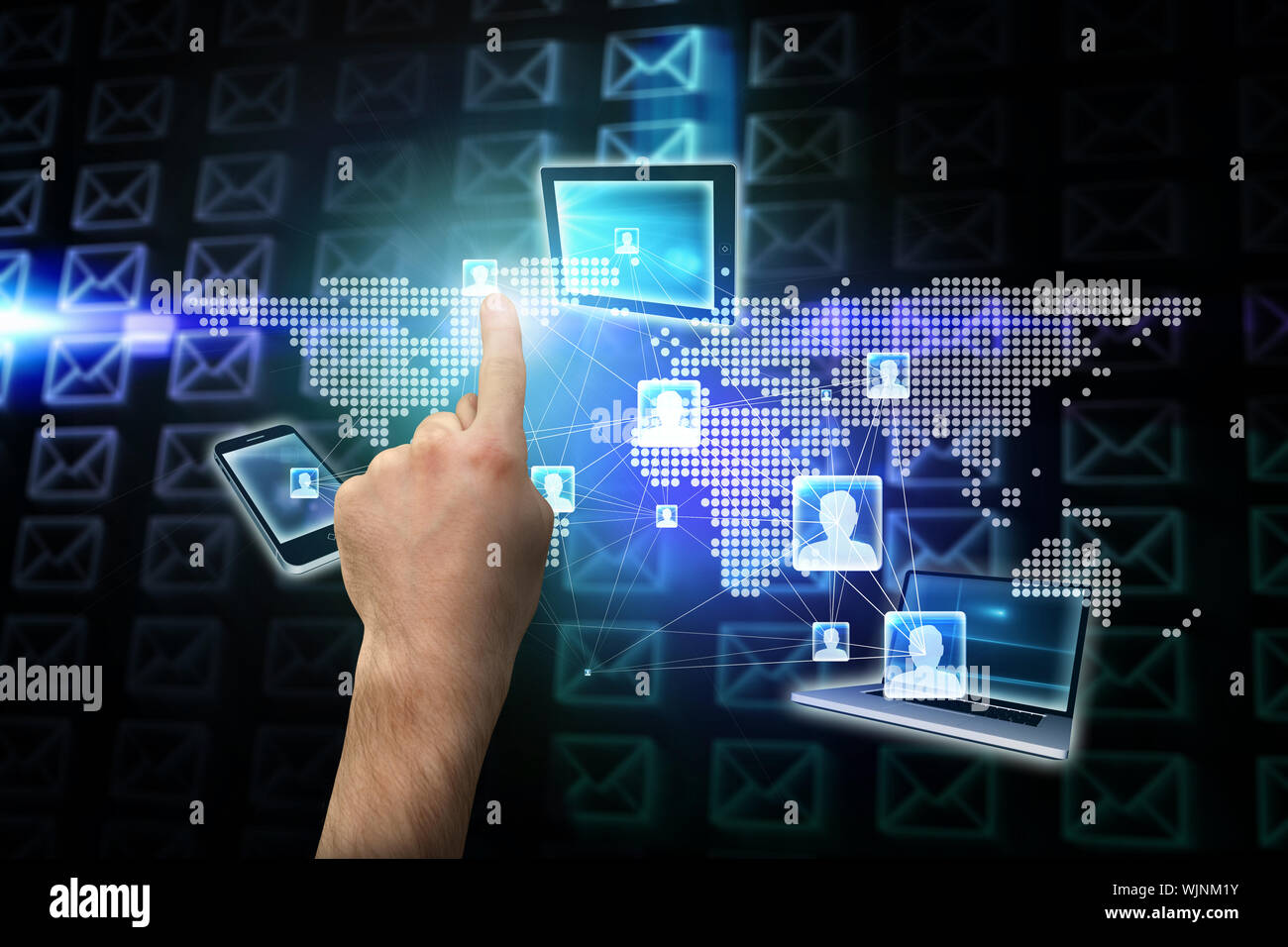 Hand pointing against glowing envelopes on black background Stock Photo