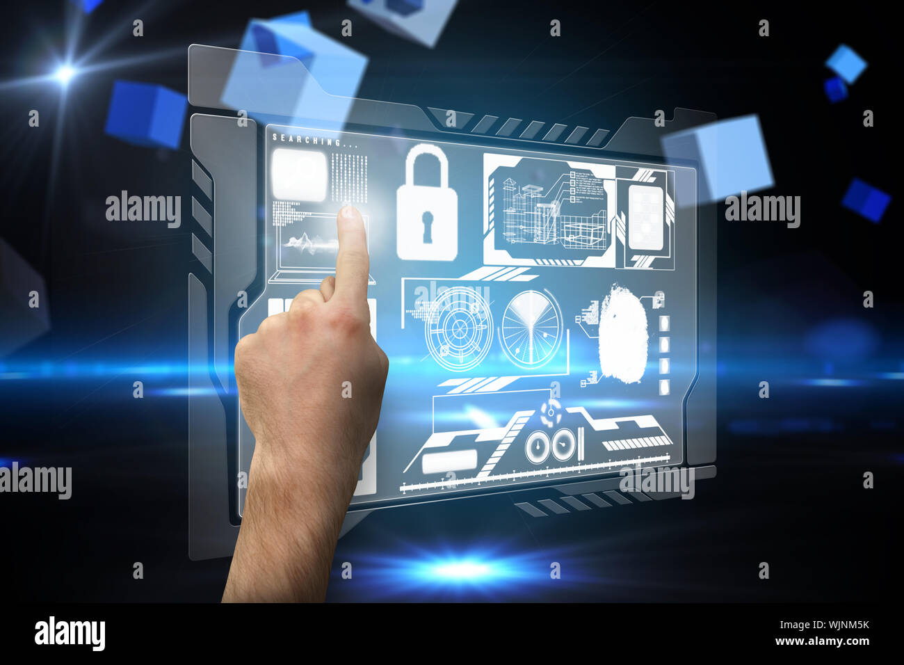 Hand pointing against boxes on technical background Stock Photo