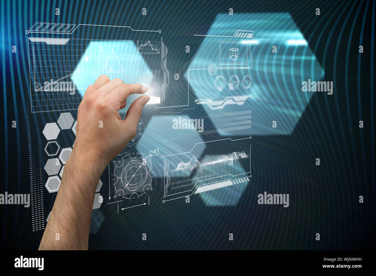 Hand presenting against shiny hexagons on black background Stock Photo