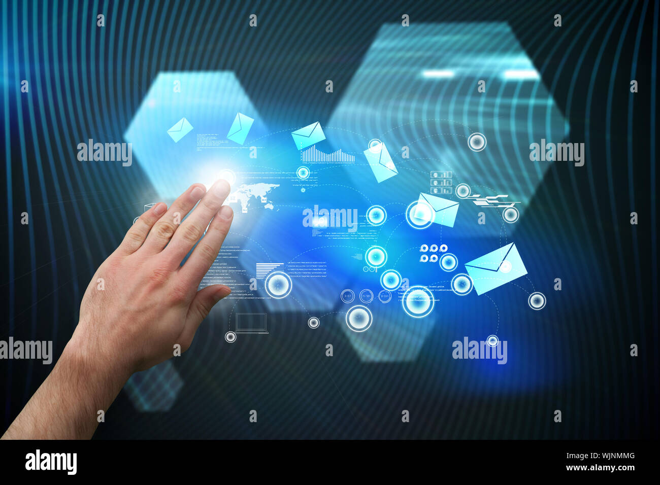 Hand presenting against shiny hexagons on black background Stock Photo