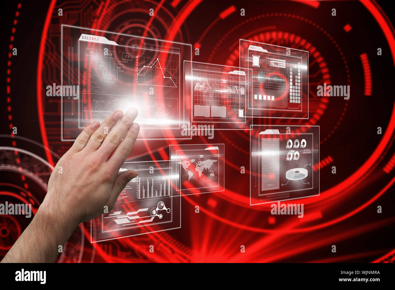 Hand presenting against shiny red circles on black background Stock Photo