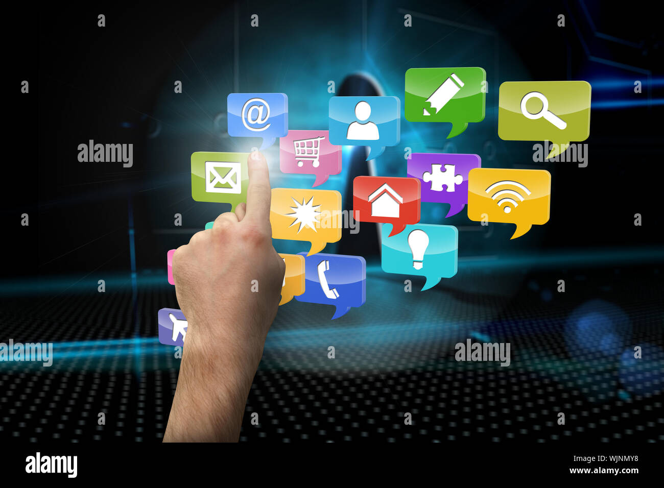 Hand pointing against keyhole on technological background Stock Photo