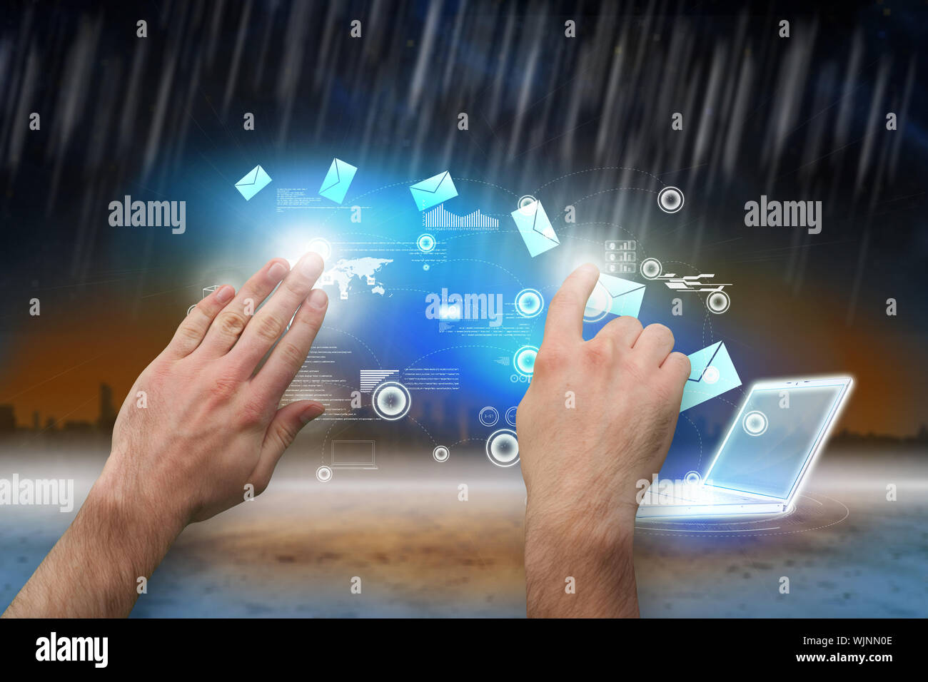 Hands pointing and presenting against cityscape on the horizon Stock Photo