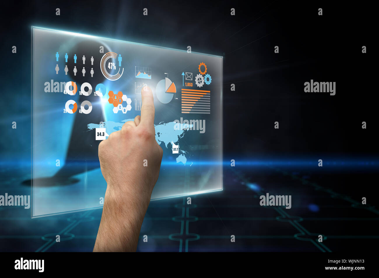 Hand pointing against keyhole on technological black background Stock Photo