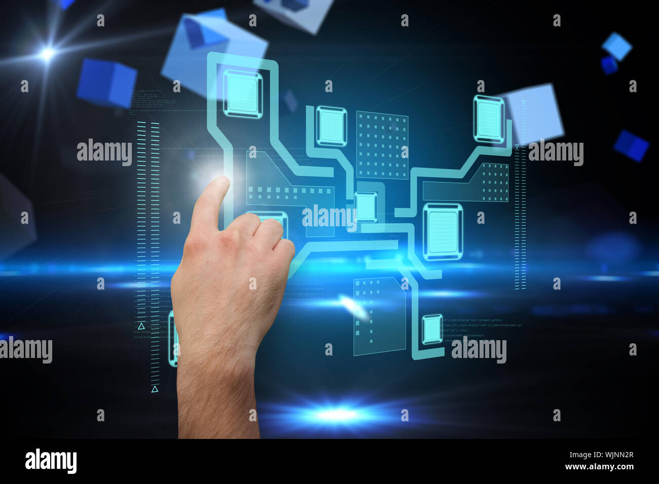 Hand pointing against boxes on technical background Stock Photo