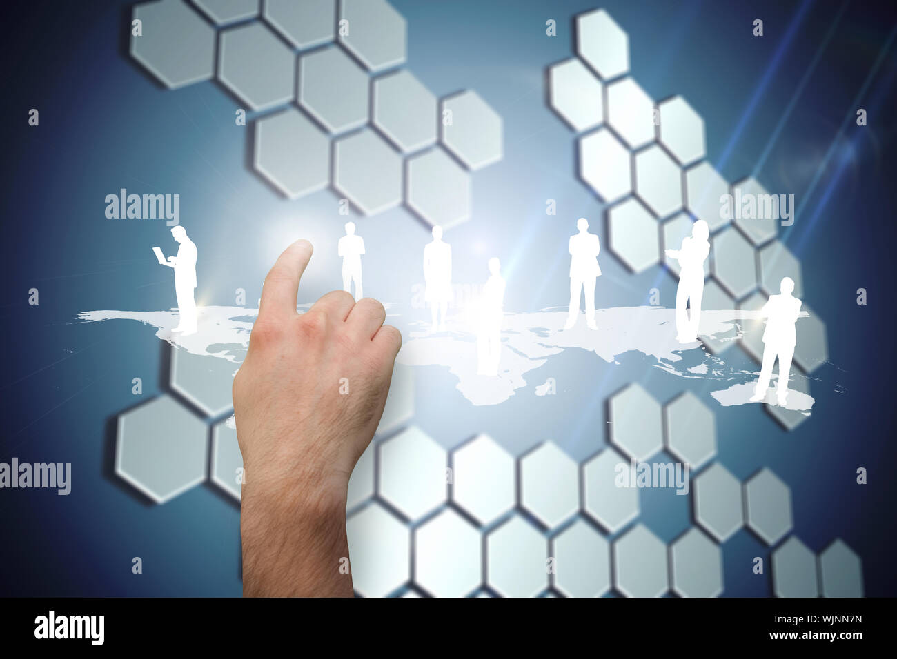 Hand pointing against technological background with hexagons Stock Photo