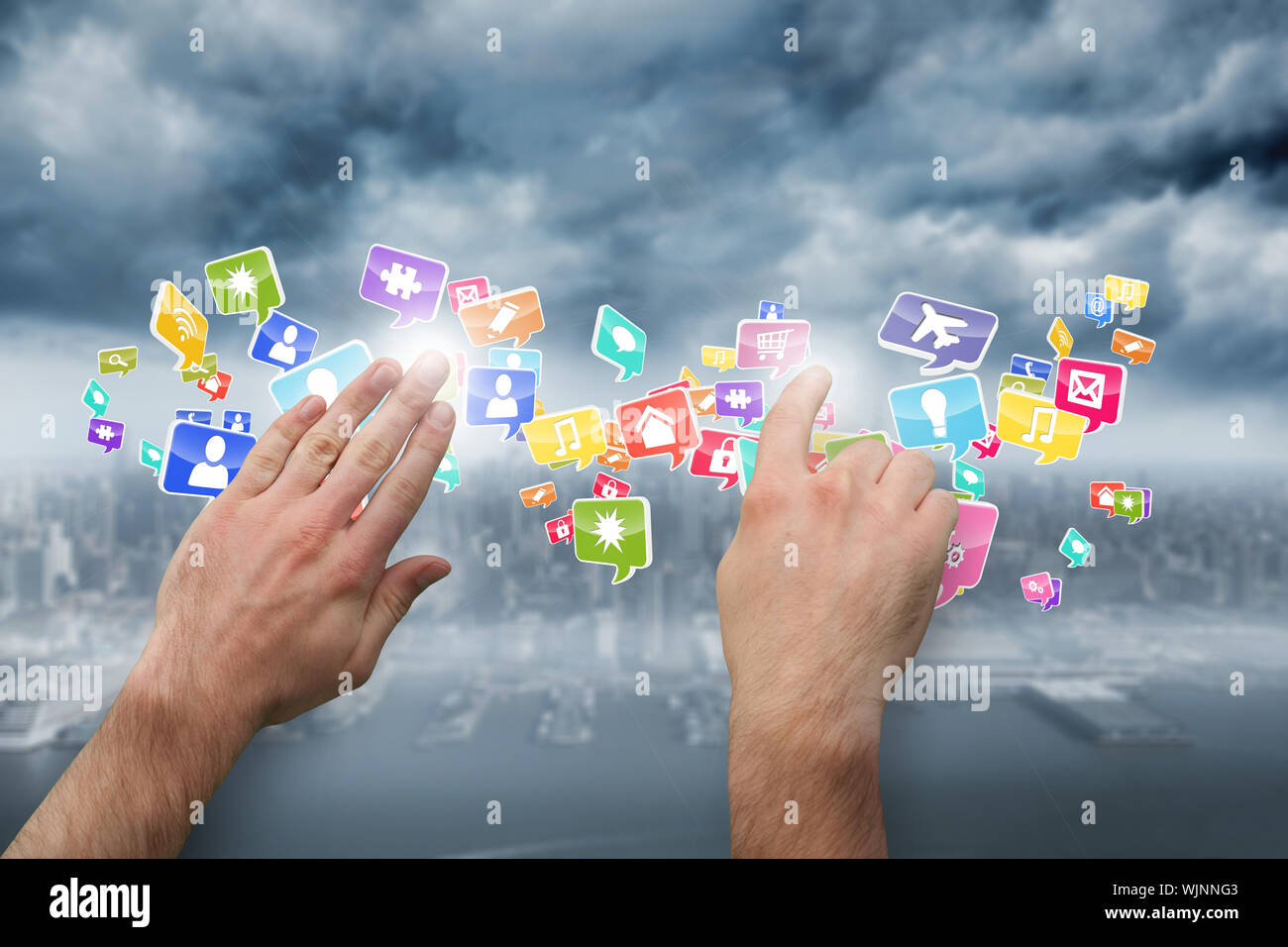 Hands pointing and presenting against coastline and city Stock Photo