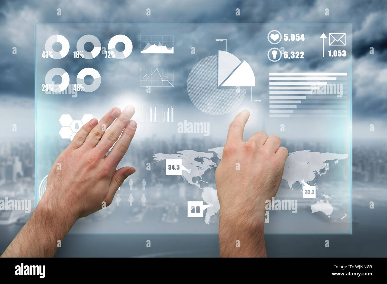 Hands pointing and presenting against coastline and city Stock Photo