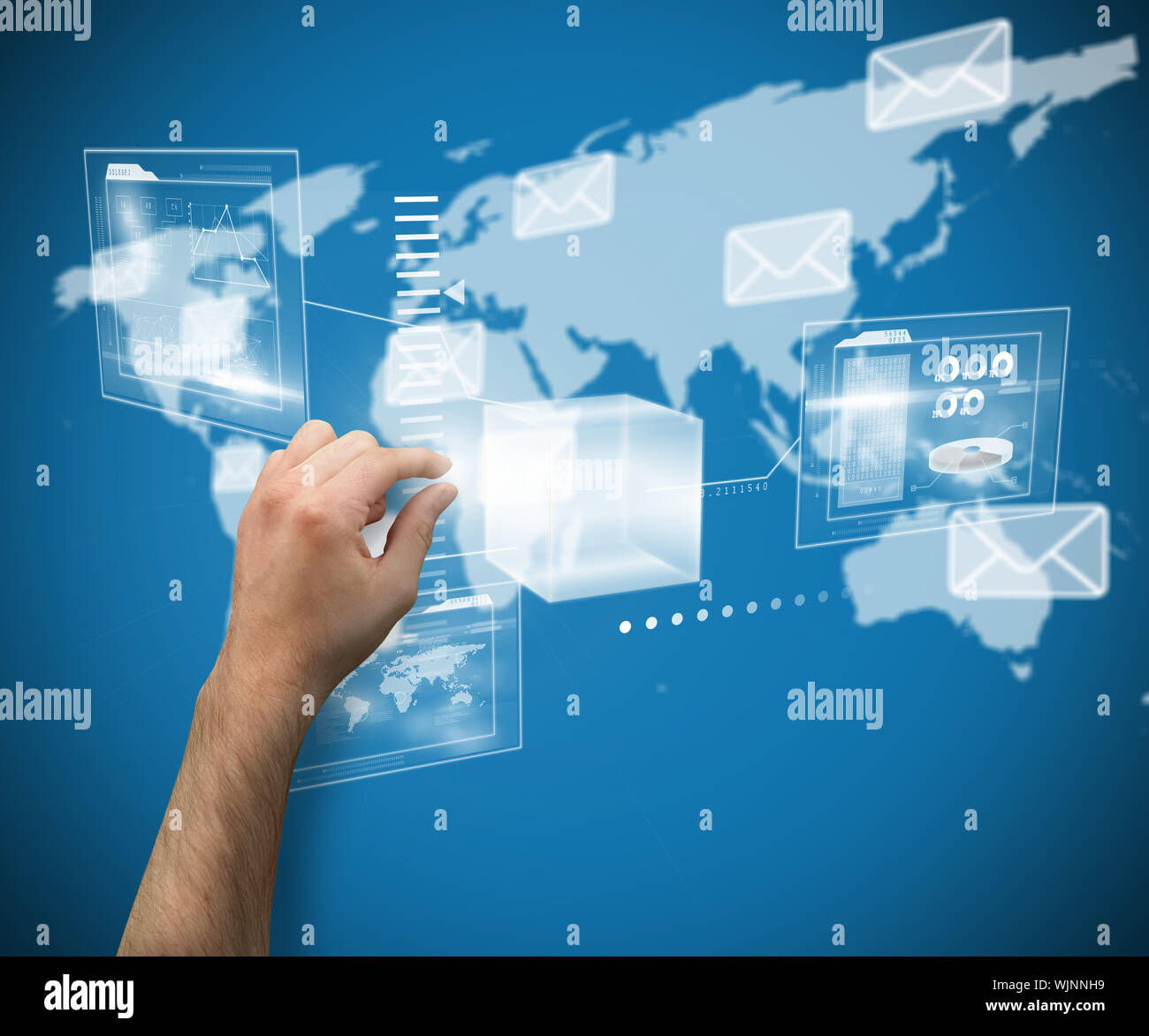 Hand presenting against world map with envelopes Stock Photo